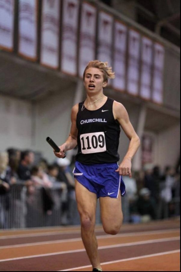 Welter sprints towards the finish line during an indoor track race.