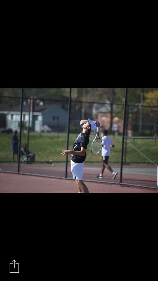 Senior+Mark+Dager+serves+the+ball+during+a+match.+Dager+and+his+doubles+partner+Austin+Yang+won+their+doubles+bracket+at+counties.