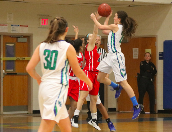 Kuchins jumps against a defender for a layup