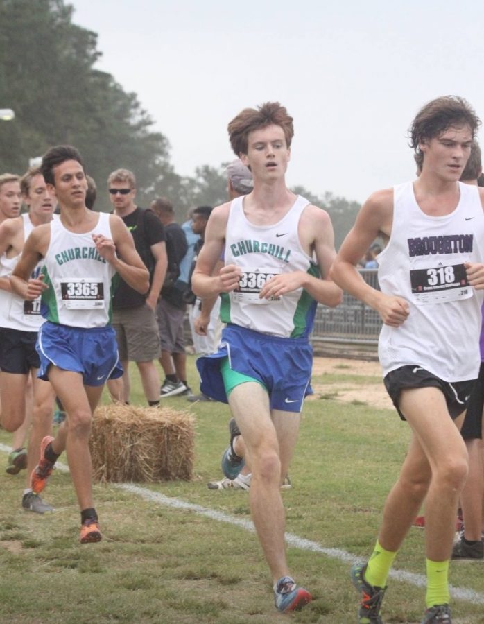 Senior Matthew Halverson runs in a cross country meet.