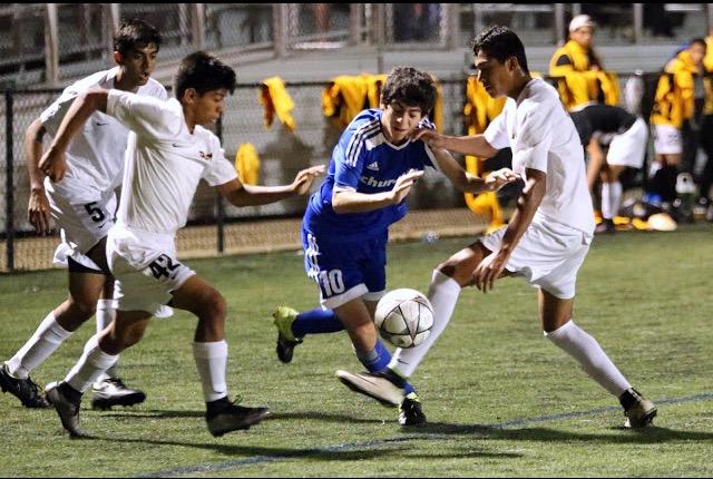 Junior Darius Siahpoosh takes the ball up the field.