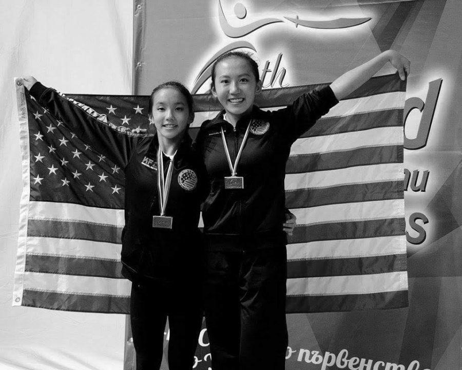 Sisters Mia Tian and Lucy Lee pose after winning medals in Bulgaria.