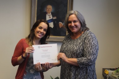 Beheler (left) accepts her award for being recognized an exceptional teacher by Stanford University alongside Laclef (right).