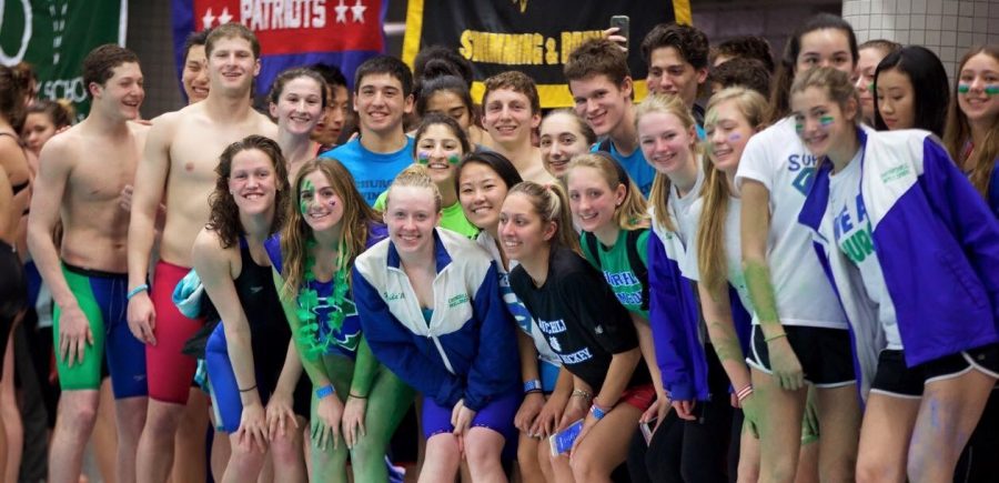 Members of the CHS Swim and Dive team pose on the pool deck after a meet last season. Last year, the girls team finished the season undefeated and the boys team finished in second place.