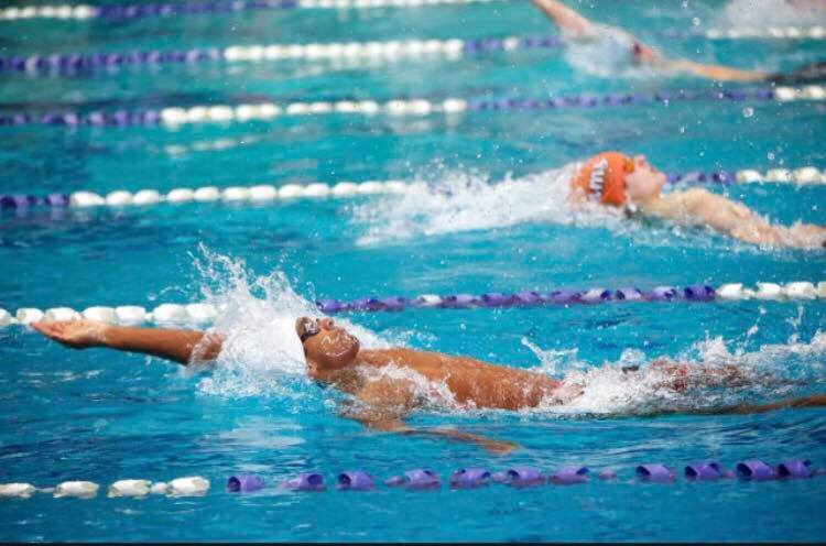 Junior Sanjay Wijesekera swims the backstroke in a
meet. He placed fourth in the 100 yard event last year.