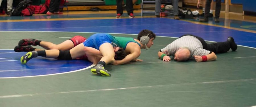 Junior Andrew Welch wrestles in a recent meet. He is credited as a team leader by fellow wrestlers.