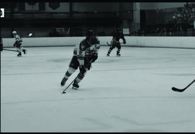 Senior Andrew Kurapov skates toward the goal in a Jan. 27 game agaisnt Wootton. The Bulldogs won 6-3 and clinched first place for the playoffs.