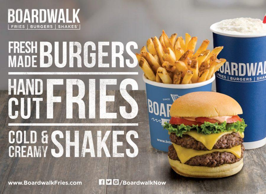 A poster advertises the new Boardwalk restaurant that just opened in Montgomery Mall. 