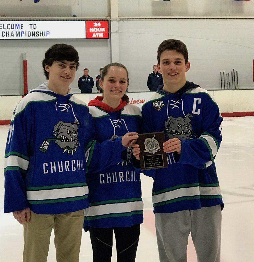 Juniors Ben Stanish, Kate Danziger and Cameron Miller accept the MSHL academic award during the pre-game ceremonies of the varsity hockey state-championship game.