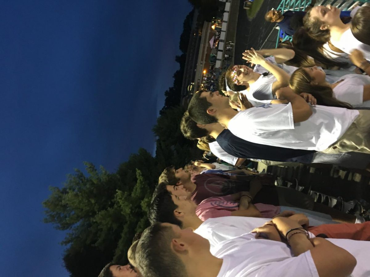 Students cheering on CHS at the football game against Whitman show spirit appropriately in white out clothing theme.