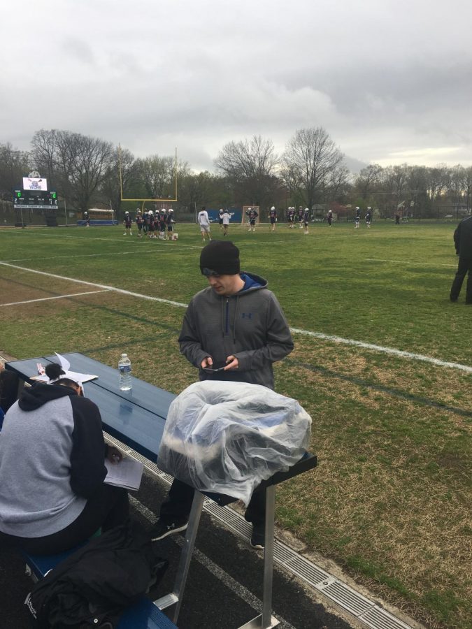 Kevin Hauschild prepares for a lacrosse game. Hauschild managed clock operations for many CHS sports and looks to apply the lessons he has learned from this experience to a career as a police officer.