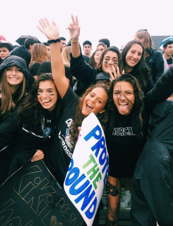 Lucia+Alem+and+friends+are+all+cheering+on+the+CHS+football+team+while+wearing+their+blackout+shirts.