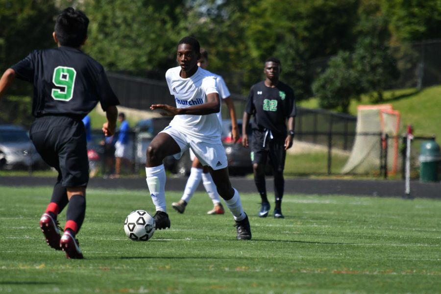 Senior Shawn Diboti-Lobe goes against players from Walter Johnson during boys soccer’s Sept. 29 game. CHS won 2-0 against  WJ.