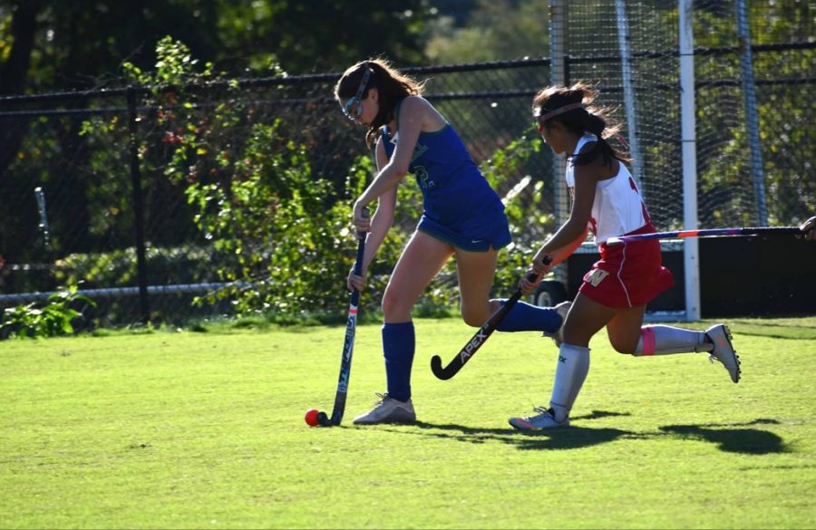 Senior Ellie Shein runs down the field with the ball during the game against Wootton High School. WCHS won the game in overtime. 