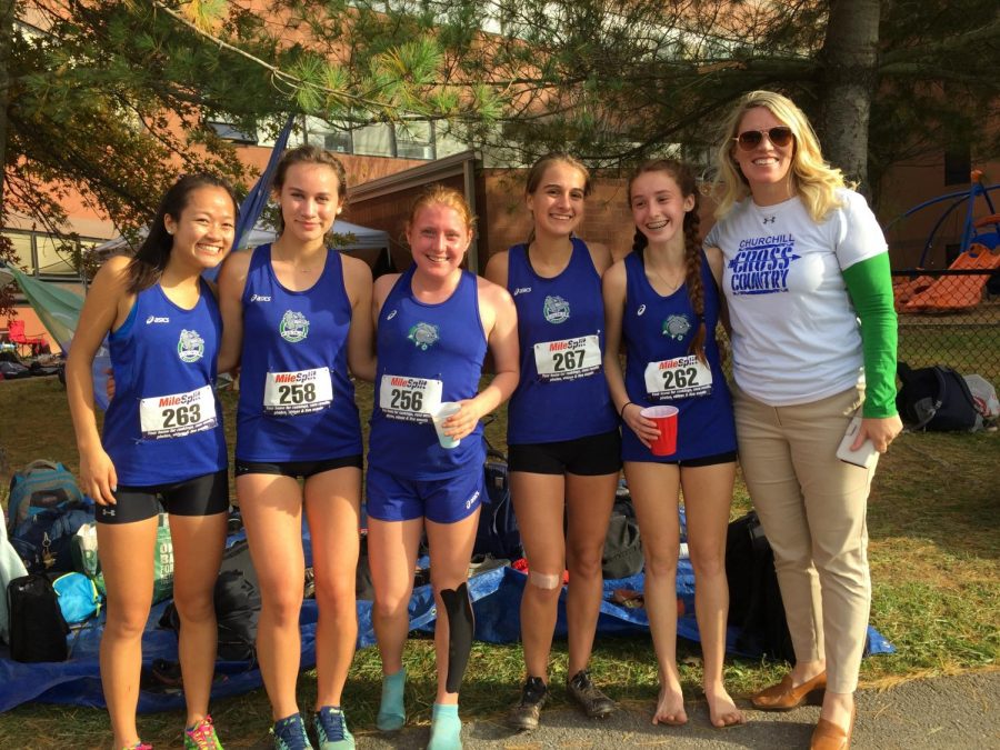 WCHS girls XC runners Lauren Kuo, Jessica Bowen, Lauren Anderson, Laura Sneller and Bridget Kelly pose with Ms. Heckert after a race.