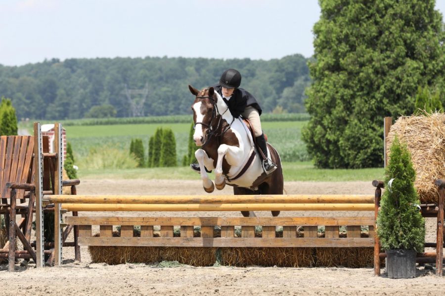 Senior Courtney Stefan rides horses because she enjoys spending time with her horse and the sport has allowed her to gain confidence. She also participates in competitions.