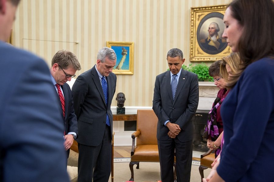 President Barack Obama and his cabinet staff participate in a moment of silence after the Sandy Hook Elementary School shooting 2012. 
