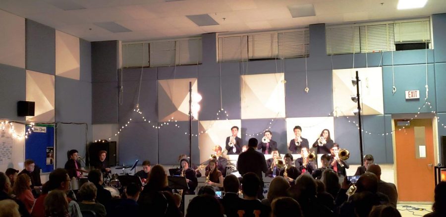 Mr.Allal conducts the Jazz Ensemble in the band room.