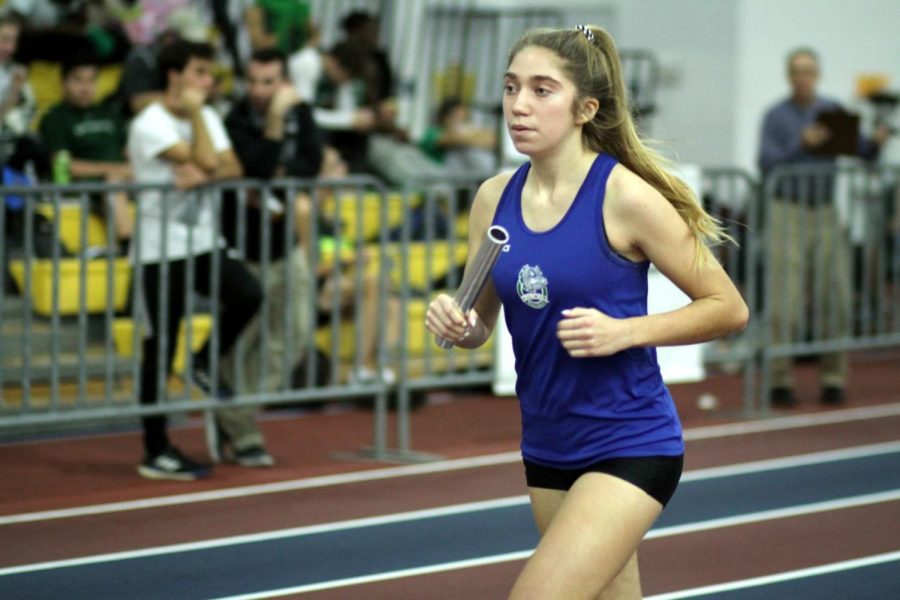 Alex Primich sprints to the finish line at the 4A West Regional Championships on Feb. 7.