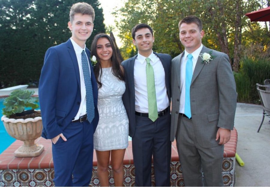 Will Hyland, Sophie Liss, Max Kandel, and Joe Raab smile for a picture together during Homecoming 2017.