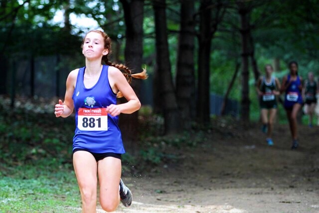 Bridget+Kelly+runs+ahead+of+the+pack+during+one+of+her+meets.+She+averaged+a+6%3A05+in+her+1600+meter+events+during+the+2019+Outdoor+Track+season.