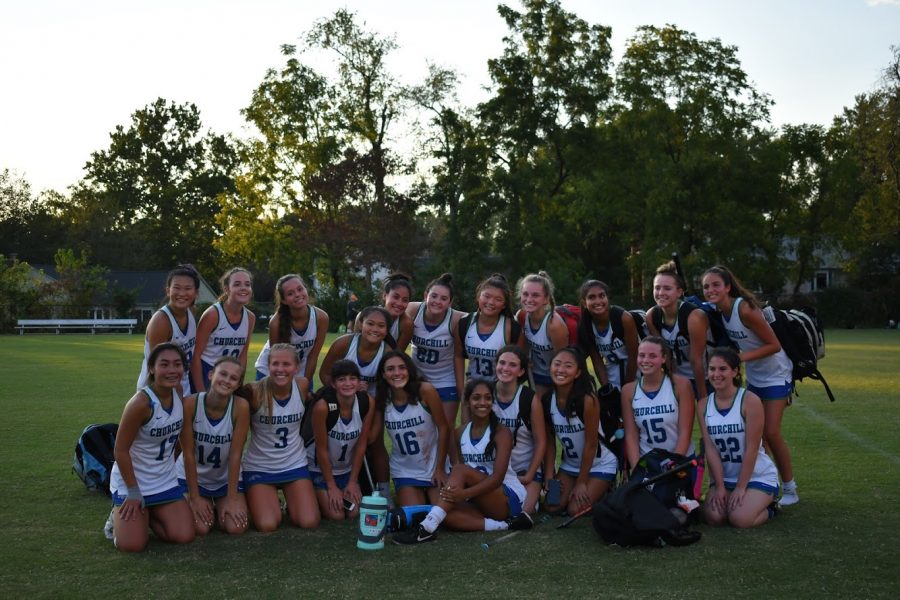 WCHS varisty field hockey team smiling after yet another successful game. 