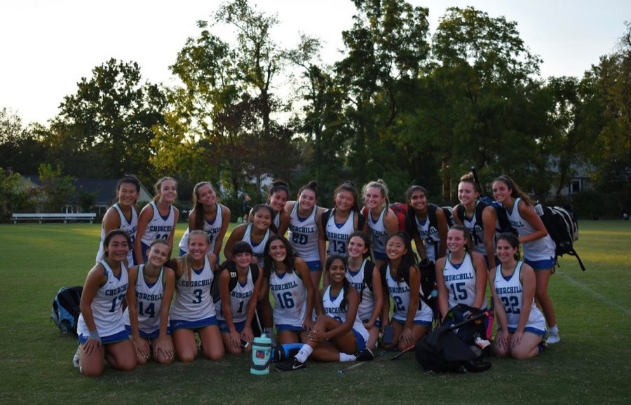 The 2019-202 WCHS field hockey team poses for a team photo on their home field.