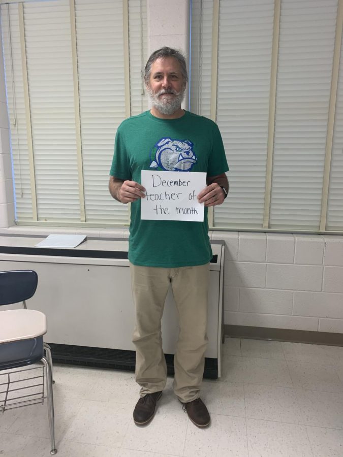 Forney poses with his TOTM award. The AP Psychology and AP World History teacher always puts in his best effort when teaching.