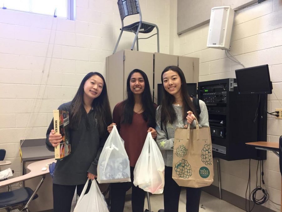  Sophomore Jessica Lin and her friends attended the EHS fourth annual book fair. Lin bought ten books./Photo 2: Students browse the books at the EHS Book Fair. There were many different genres of books including fantasy, historical fiction and test-prep books.