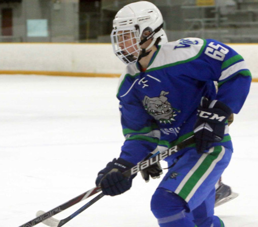 Senior Nick Carline drives against Landon School in one of their toughest games of the season. The game was played at Rockville Ice Arena on Dec. 4, 2019.