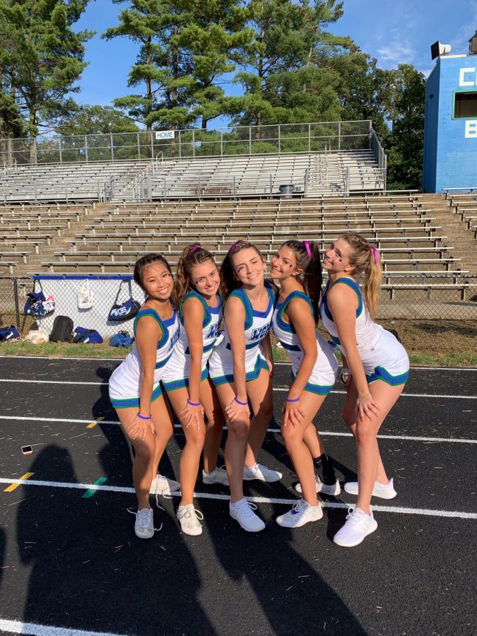 Varsity cheerleading captains Kathy Hu, Cat Gilligan, Danielle Probert, Ally Salzberg and Peyton Kanstoroom help run practices and promote teamwork throughout the seaon.  