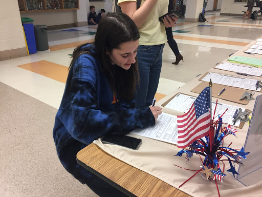Junior Liz Porter is registering to vote at WCHS during lunch. The Montgomery County Board of Elections registered students three days during lunch.