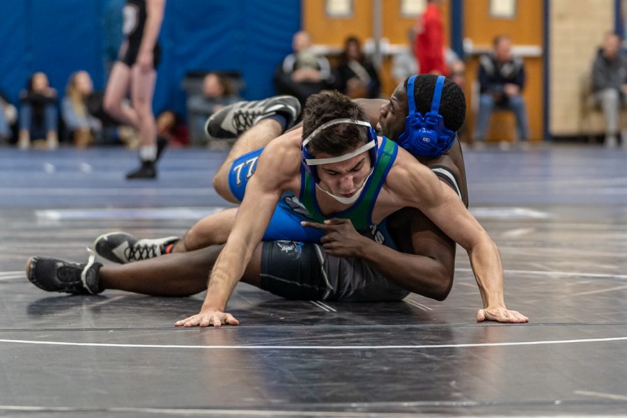 Junior Max Kessler earning a point for his takedown against a very skilled opponent. 