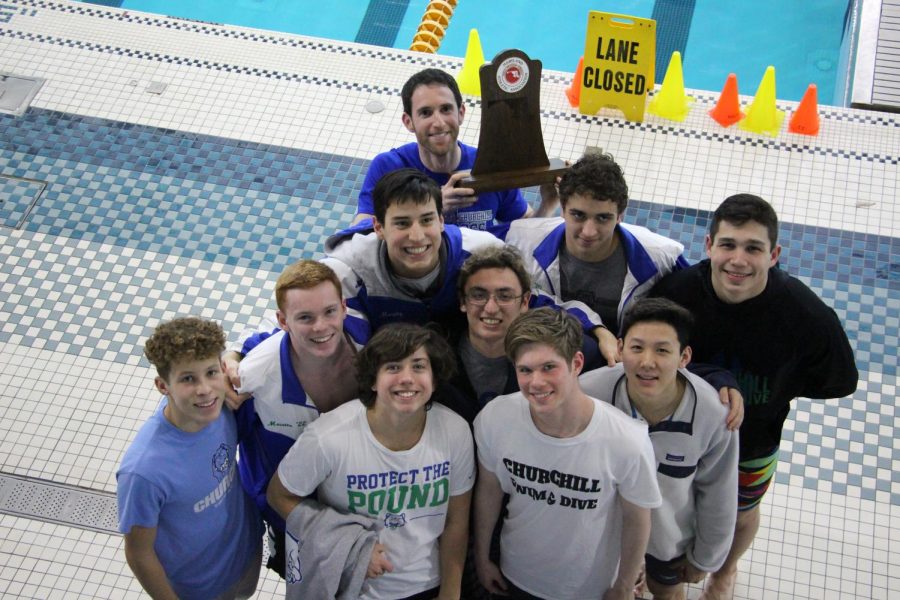 Casey+Meretta+and+his+teammates+on+the+WCHS+Swim+and+Dive+team+pose+with+their+trophy.+The+won+second+place+at+the+Maryland+State+Championships.