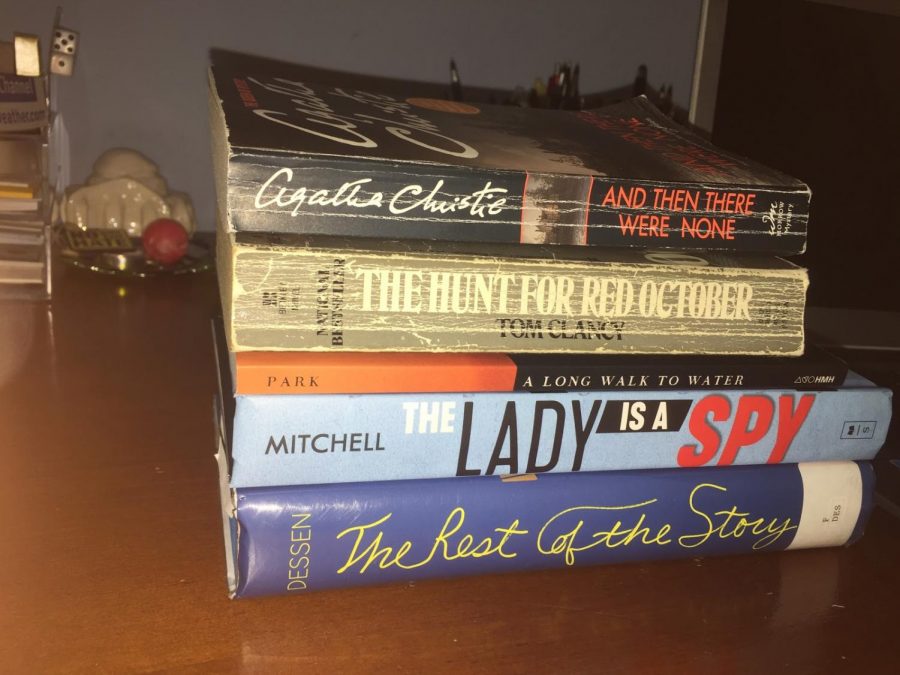 The covers of each of the top 5 books to read during coronavirus stacked on top of each other. While none of them are about a pandemic, they all have topics that can relate to this time.