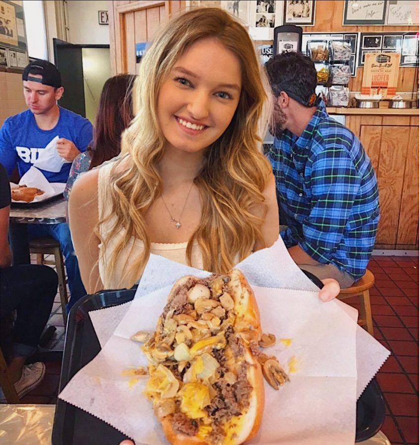 Senior Anna Kronthal poses in Philadelphia after driving on a school day. The Philly Cheesesteak Challenge is a senior class tradition in which students drive up and buy a cheesesteak in one day. The Class of 2020 will not be able to participate in this activity.