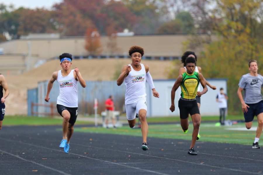 Andrew Xue (far left) races in the 100 meter event at the Urbana Track Series Meet, head-to-head with fellow WCHS runner Langston Major. Xue finished second overall in the event. With no MCPS indoor track season, Xue took it upon himself to run at club track meets for the Corentyne Coasters. 