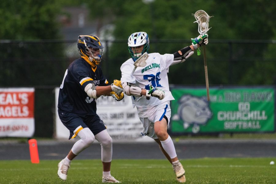 Captain, Eliot Dubick, makes his way around a BCC player to then score a goal for Churchill. 