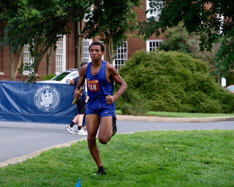 Senior+Sebby+Breton+runs+ahead+of+the+pack+at+the+Woodward+Relays+at+Georgetown+Prep+on+Sept.+4+2021.+Breton+first+joined+cross-country+sophomore+year+and+has+become+the+number+one+runner+on+the+team.++