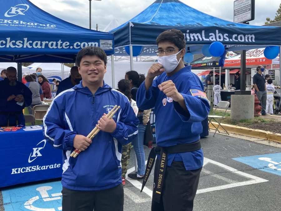 Seniors Aryaan Duggal (right) and Ryan Jen (left) show off what they did at Potomac Day on Oct. 23. Duggal manned the stand at Kicks Karate, while Jen led the WCHS drumline in the parade.