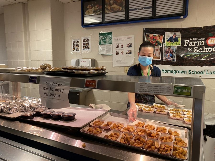Cafeteria manager Brenda Tam distributes a variety of lunch options to students. Although all options are free, they are required to get a meal and a fruit to make sure they get all of the nutrients they need. 