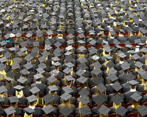 Students sit at graduation ready to move on to the next part of their life. In order to get to this moment students often stress themselves out jam-packing their schedule with extracurriculars in order to get into college.