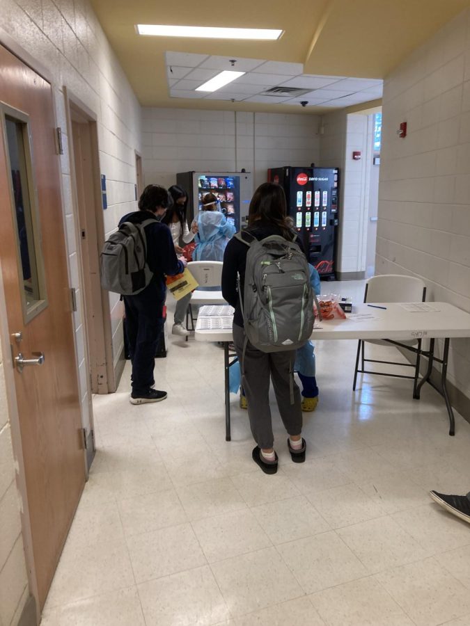 Students wait in line for COVID-19 screening testing on Dec. 7. Students were randomly-selected to particpate in the testing, which MCPS recently rolled out at all schools.