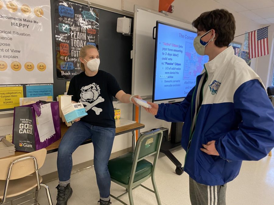 WCHS teacher Erin Brown passes out the biweekly MCPS-issued KN-95 masks to her students. 