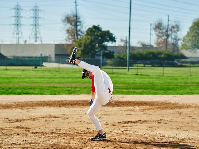 Practicing his elite pitching Gomes, unusually large leg kick gives him a strange advantage over opposing hitters.