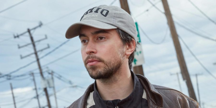 The cover of Alex G’s new album, “God Save The Animals,” includes a painting of four parrots perched on top of a barren tree.