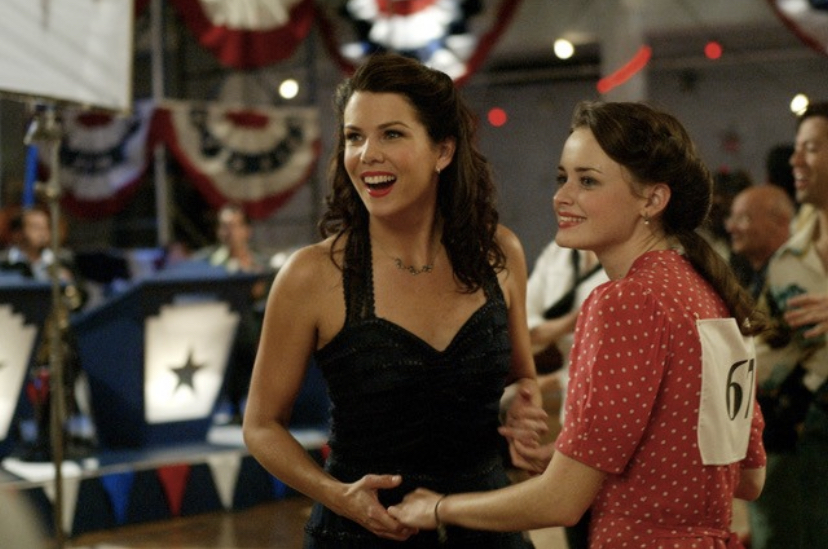 Rory Gilmore (Alexis Bledel) and Lorelai Gilmore (Lauren Graham) dance together in this episode of “Gilmore Girls” on Netflix, a comfort show staple for the fall season.