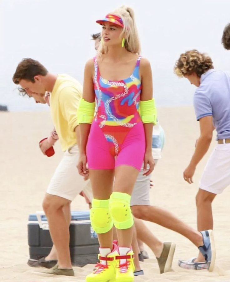 Margot+Robbie+was+spotted+on+set+decked+out+in+a+neon+skater+outfit+while+filming+her+upcoming+movie%2C+Barbie.+This+70s+inspired+costume+is+a+fun+and+unique+way+to+dress+up+for+Halloween.