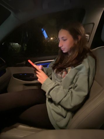 Sophomore Julieta Matus scrolling through Tik Tok on her phone. Matus has a screen time of at least three hours a day on just tik tok. Constantly on the phone scrolling through different social medias.