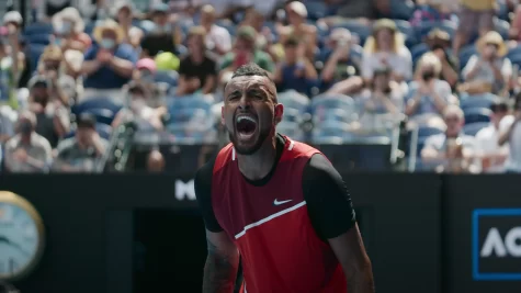 Australian male tennis player Nick Kyrgios, who is featured on the Netflix show “Break Point,” roars in excitement after an intense match.